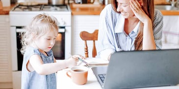 child sitting with mother on a computer deciding about changing her name