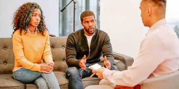 couple talking to a therapist during a counseling session
