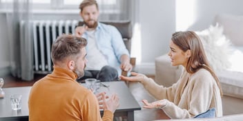 couple having a heated argument during a mediation or counseling session