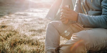 person relaxing in nature and sunlight