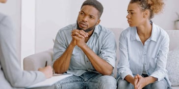Black couple speaks with a mediator about divorce issues
