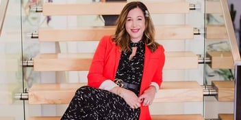 CEO Erin Levine sits on the stairs