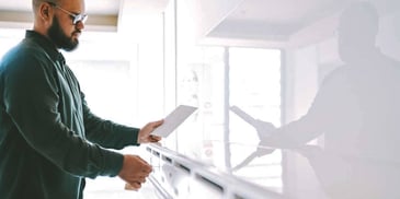 man looking at mail