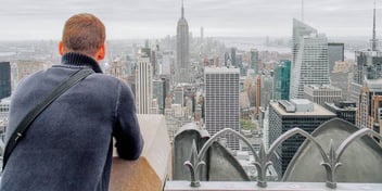 Man looks out over New York City
