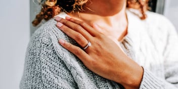 Woman thinks about what to do with her engagement ring