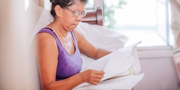 woman reviewing paperwork needed for her divorce